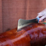 Roast pig and engraved knife